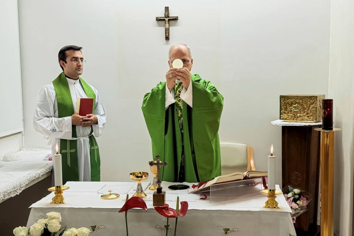 This picture, released by Vatican Media on Friday, Oct. 16, 2026, shows Pope Leo XIV, flanked by his personal secretary, Monsignor Edgard Iván Rimaycuna Inga, left, celebrating Mass at the Agostino Gemelli Polyclinic in Rome, where he is recovering after