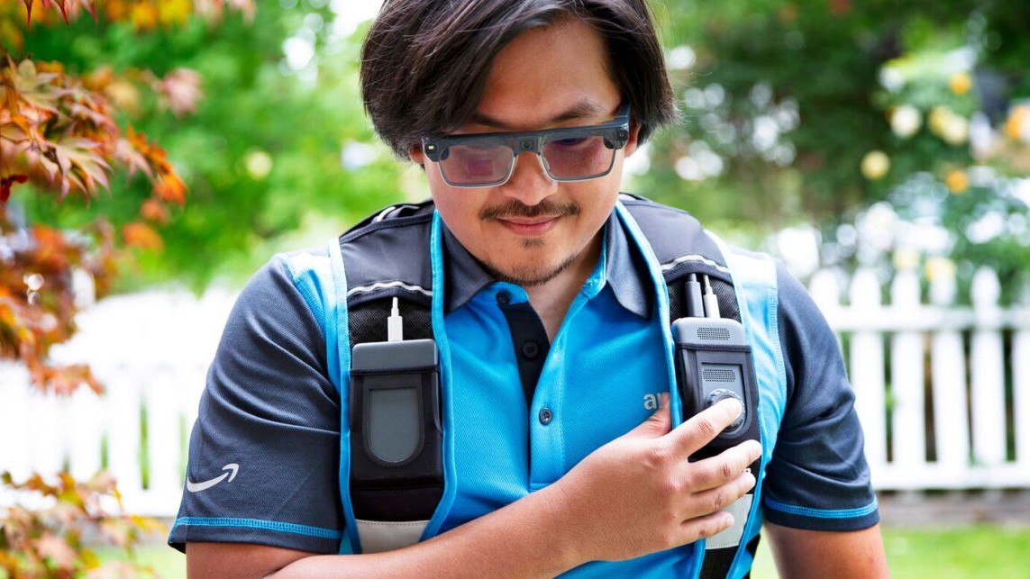 Asian man wearing an Amazon shirt and AI smart glasses.
