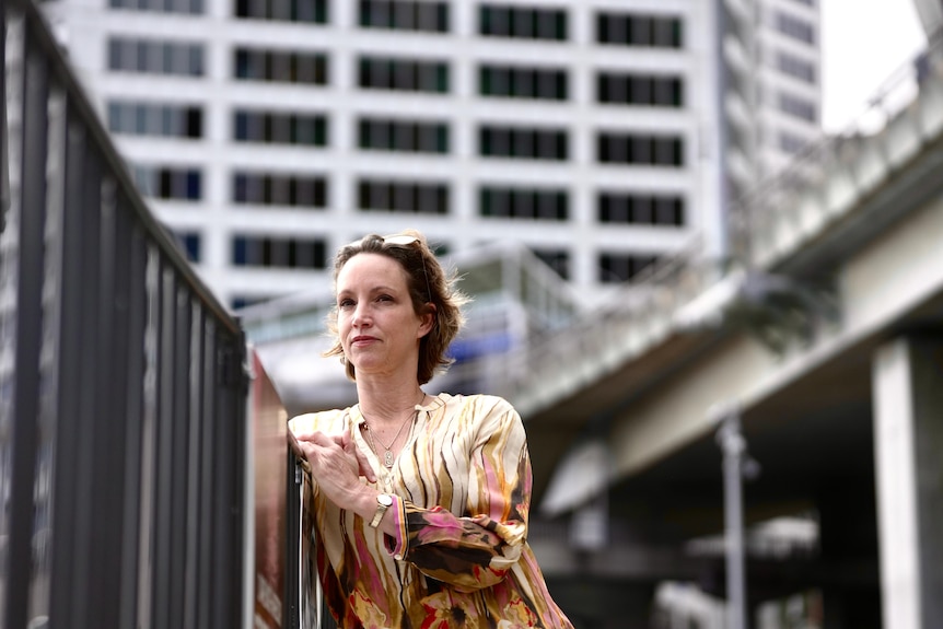 Candice Driver looks out over a handrail in Sydney.