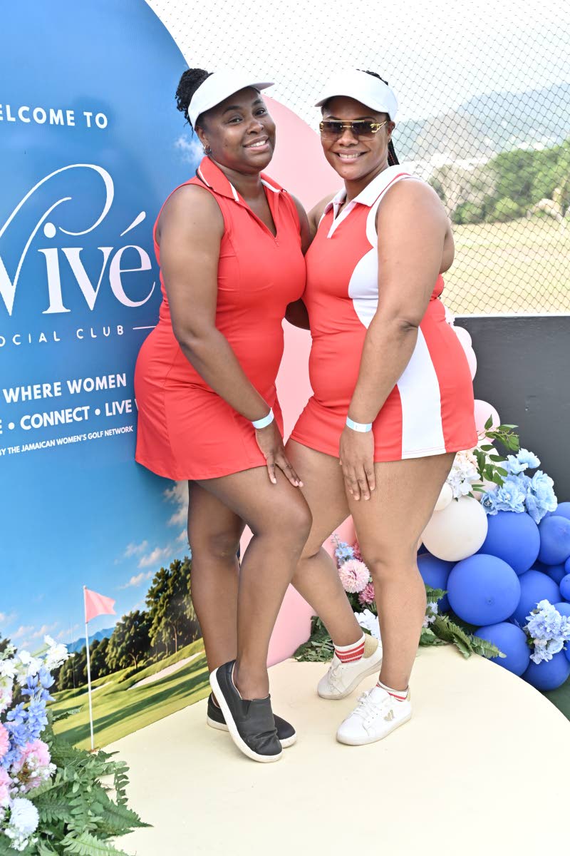 Claudia Crosby (left), human resources manager, and Accounts Payable Manager Sasshawna Prince coordinate in sporty red-and-white looks, completed with visors.